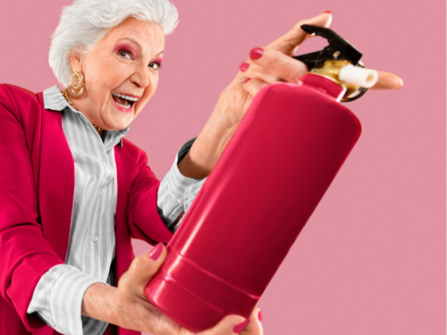 elderly lady with a fire extinguisher